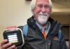 MIT Emergency Management’s David Barber shows off one of the new AED devices that he is helping to bring to every building on MIT’s campus.